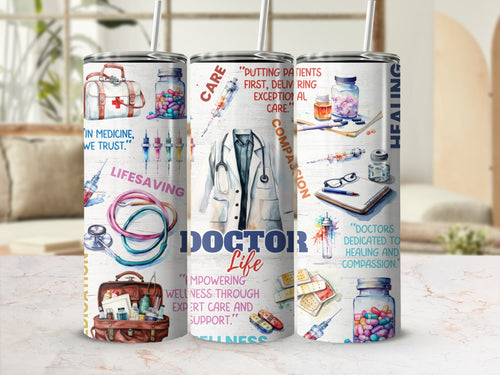 Doctor Life 20oz skinny tumbler with lid and straw, stethoscope and white coat wrap, styled on a table